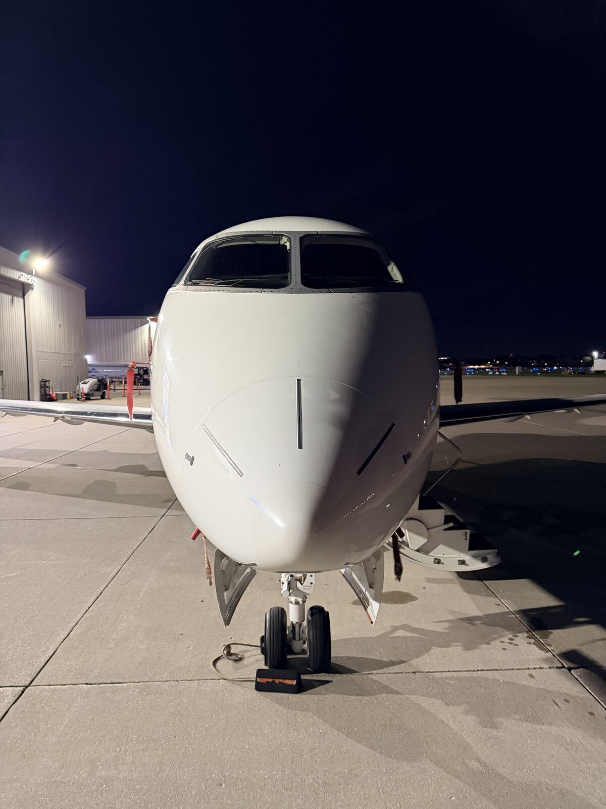 Bombardier Challenger 300 nose radome front view ramp night exterior aviation detailing Chicago