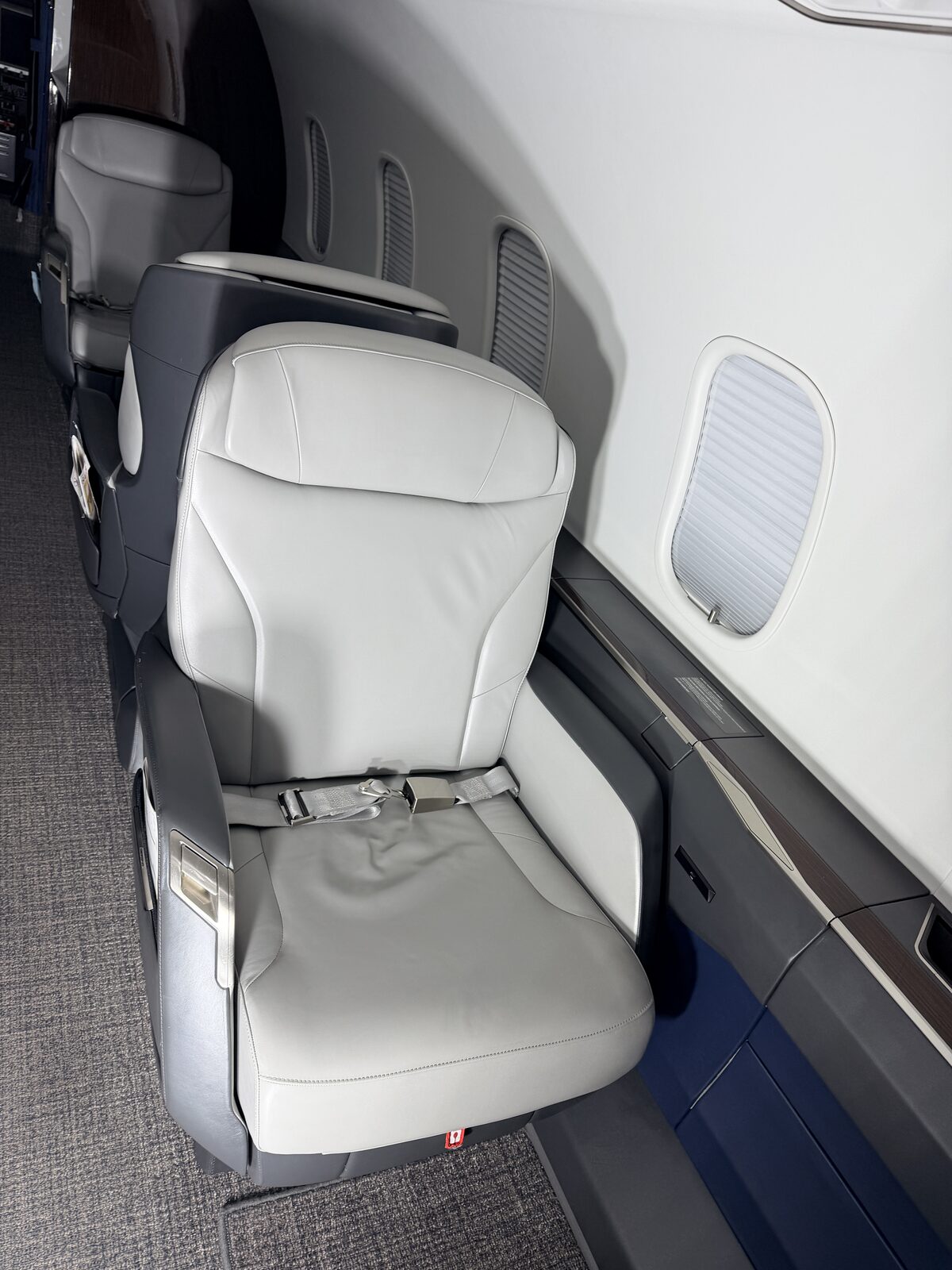 Bombardier Challenger 350 interior club seat window blue sidewall accent seatbelt detailing Chicago